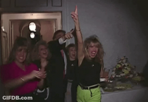 Group Of Women Posing One In Neon Green Shorts GIF