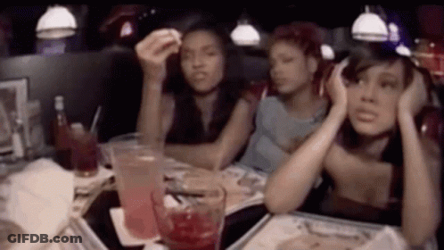 Group Of Women Sitting At Diner Table With Drinks GIF