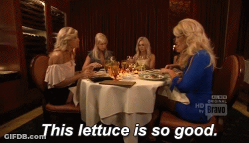 Group Of Women Sitting At Table Saying This Lettuce Is So Good GIF