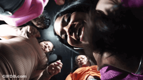 Group Of Women Sitting In Circle Looking Down GIF