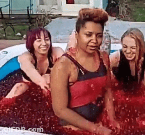 Group Of Women Sitting In Red Liquid Pool GIF