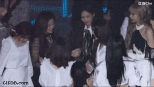 Group Of Women Standing Around Table GIF
