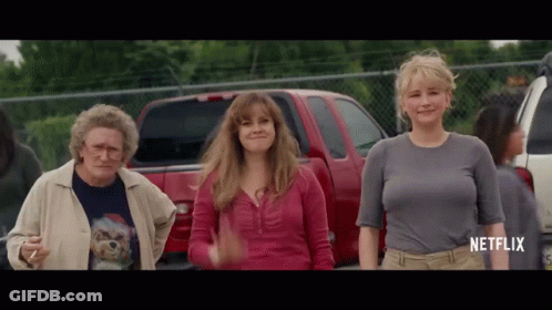 Group Of Women Standing By Red Truck GIF