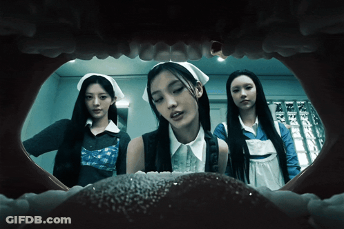 Group Of Women Standing In Dark Room GIF