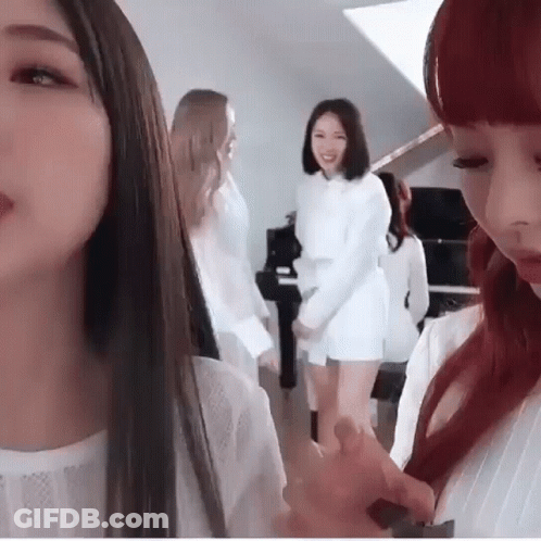 Group Of Women Standing In Front Of Piano GIF