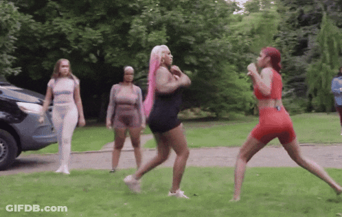 Group Of Women Standing In Grassy Area With Car GIF
