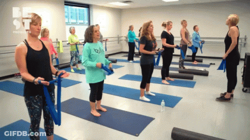 Group Of Women Standing On Yoga Mats With Be St Logo GIF