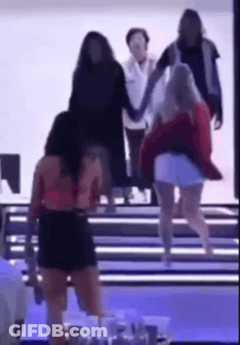 Group Of Women Walking Down Staircase Holding Hands GIF