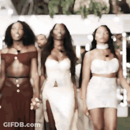 Group Of Women Walking On Runway GIF