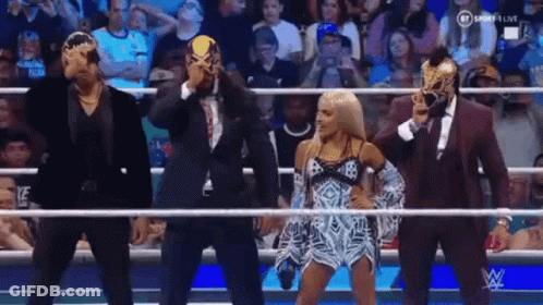 Group Of Wrestlers In Ring Wearing Masks GIF