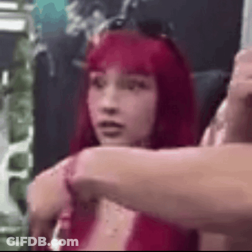 Group Of Wrestlers Standing Hands Behind Heads GIF