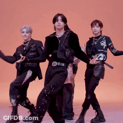 Group Of Young Men Dancing One With Shirt Saying Premium GIF
