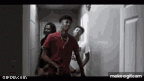 Group Of Young Men In Hallway One In Red Shirt GIF