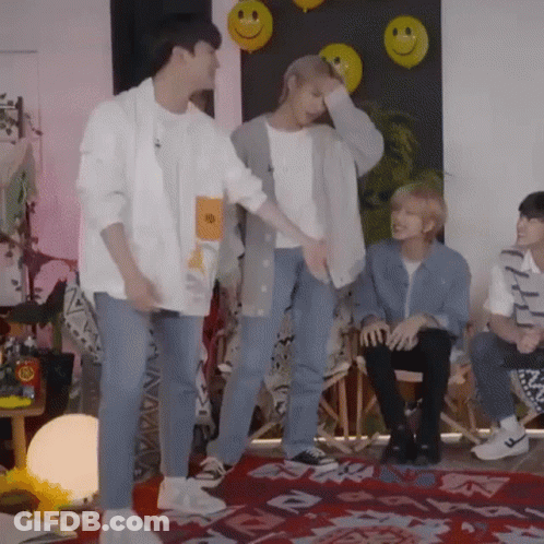 Group Of Young Men In Room With Balloons GIF