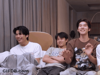 Group Of Young Men Laughing On Couch GIF