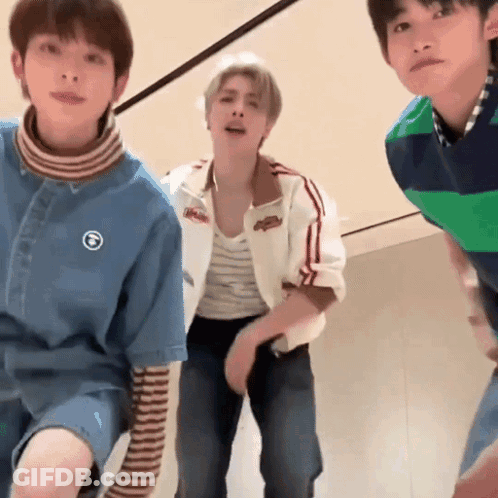 Group Of Young Men Looking At Camera GIF