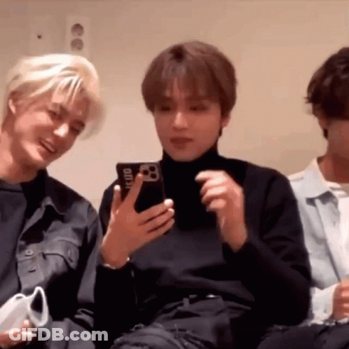 Group Of Young Men One Holding Cell Phone GIF