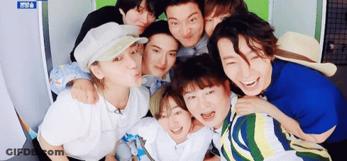 Group Of Young Men Posing And Smiling GIF