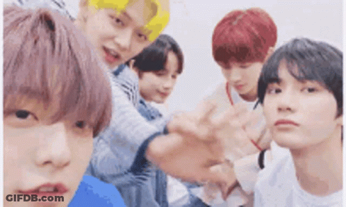 Group Of Young Men Posing For Picture GIF