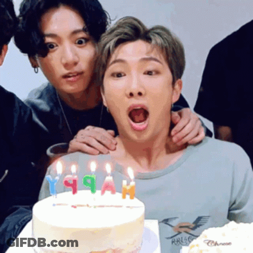 Group Of Young Men Posing With Birthday Cake GIF