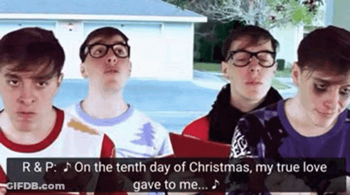 Group Of Young Men Singing Christmas Carols GIF
