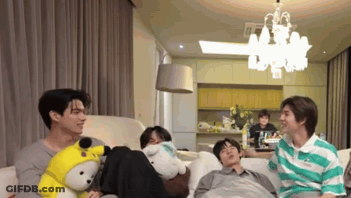 Group Of Young Men Sitting On Couch Talking GIF