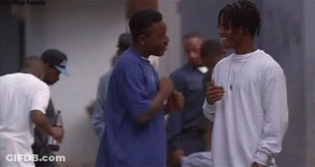Group Of Young Men Standing In Crowd GIF