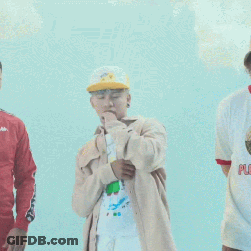 Group Of Young Men Standing In Front Of Blue Background GIF