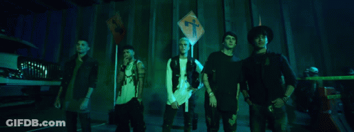 Group Of Young Men Standing In Front Of Cross Sign GIF