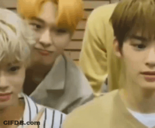 Group Of Young Men Standing In Front Of Wall GIF