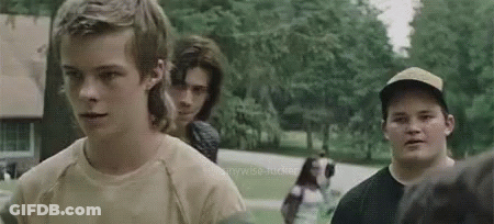 Group Of Young Men Standing On Street GIF