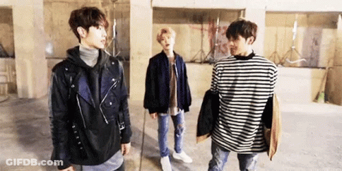 Group Of Young Men Standing Together In Room GIF