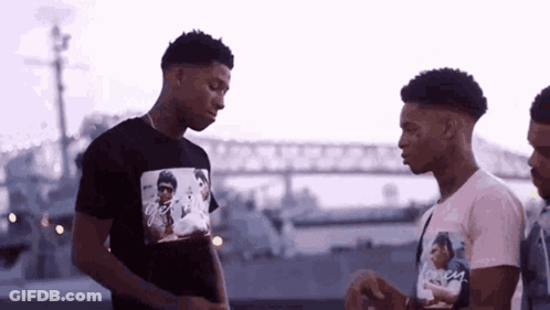 Group Of Young Men Talking Near Bridge GIF