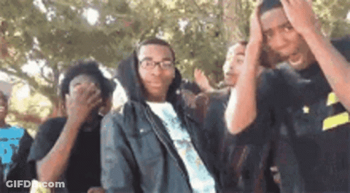 Group Of Young People Covering Faces GIF