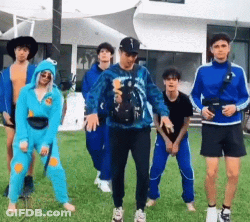 Group Of Young People In Grassy Field GIF