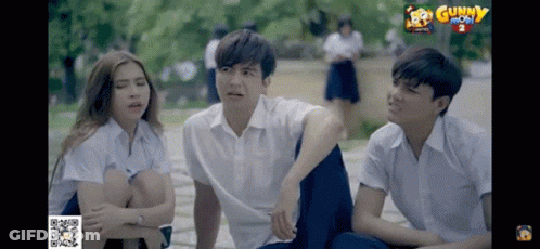 Group Of Young People Sitting In Front Of Gunny Screen GIF