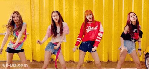 Group Of Young Women By Yellow Wall GIF
