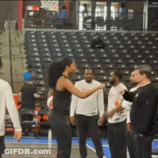 Group On Basketball Court With NBA Shirt GIF