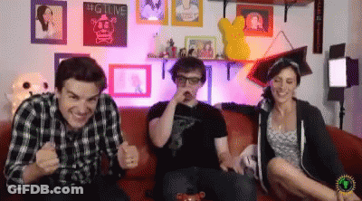 Group On Couch With Big Live Sign GIF