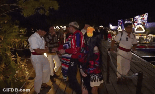 Group On Dock At Night Wearing Mexico Shirt GIF