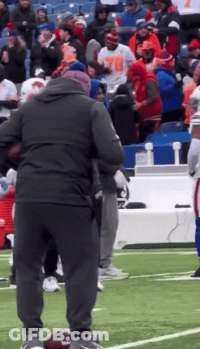 Group On Football Field With Man In Number 78 Shirt GIF