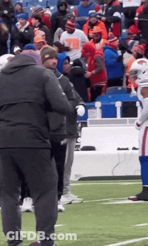 Group On Football Field With Man In Number 78 T-Shirt GIF