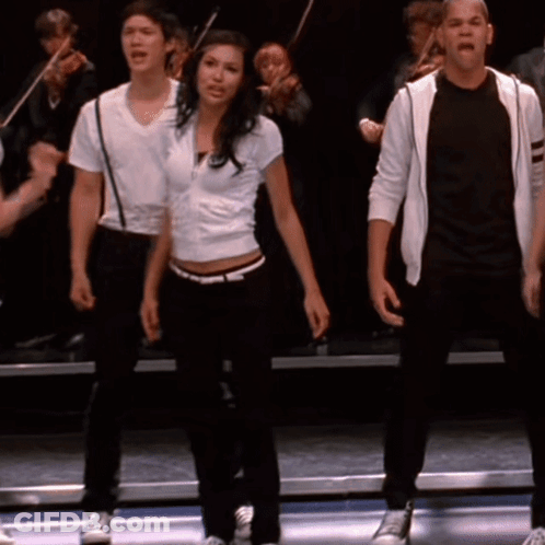 Group On Stage One In White Shirt GIF