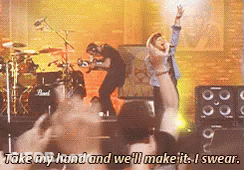 Group On Stage Saying Take My Hand And We'll Make It Swear GIF