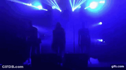 Group On Stage With Blue Lights GIF