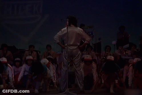 Group On Stage With Hideki Sign GIF
