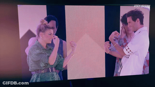Group On TV Screen With AX Letters GIF