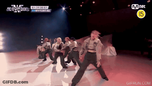 Group Performing On Stage With Mnet Logo GIF