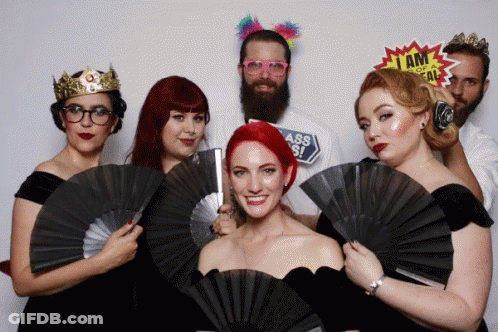 Group Photo With I Am A Freak Sign GIF