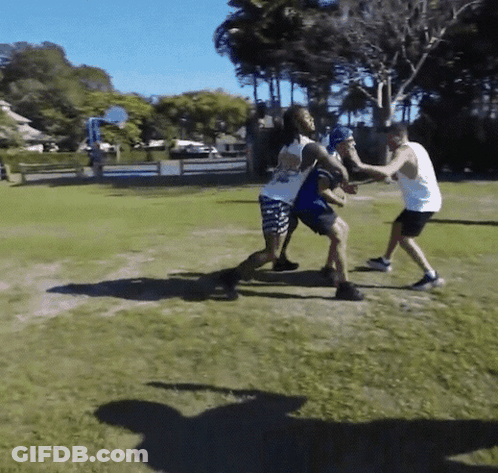 Group Playing Basketball In Field GIF